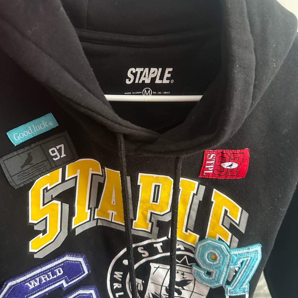 Staple Black Hoodie with Yellow and Blue Accents